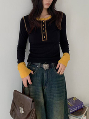 A long-sleeved knitted top in contrasting colors for women