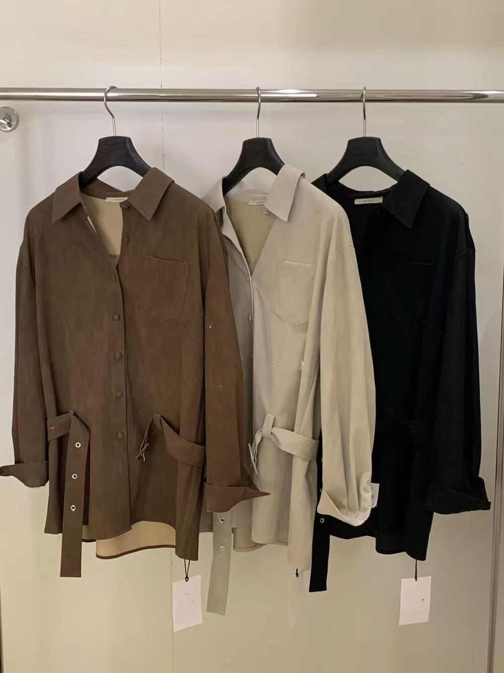 A loose casual shirt with a lady's belt A loose casual shirt with a lady's belt