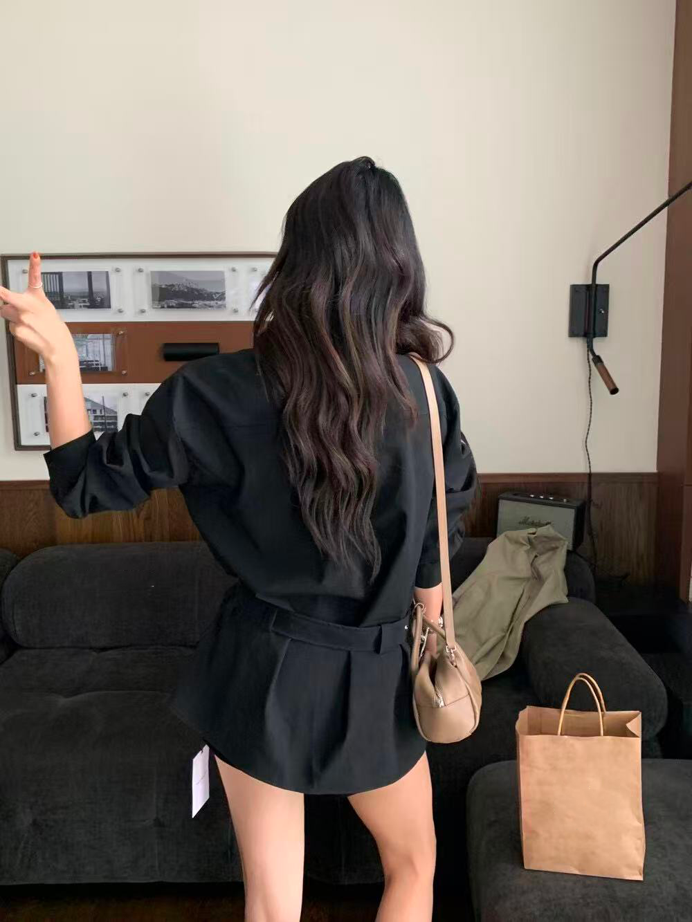 A loose casual shirt with a lady's belt A loose casual shirt with a lady's belt