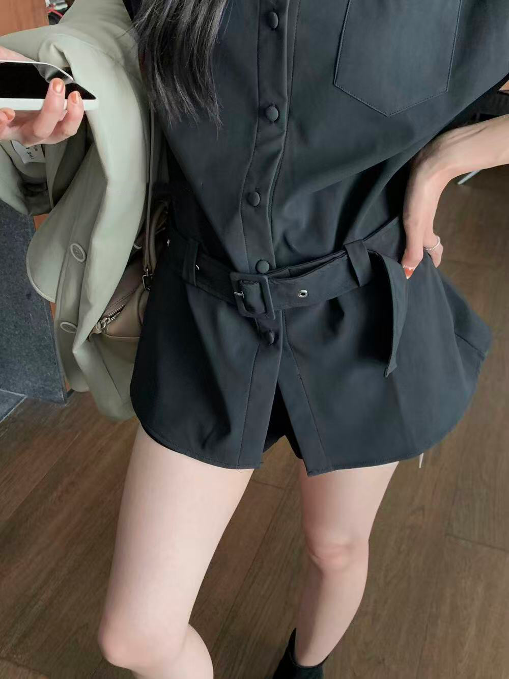 A loose casual shirt with a lady's belt A loose casual shirt with a lady's belt