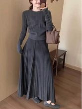 A women's knitted top skirt set