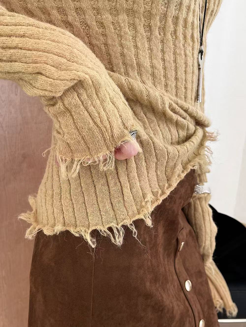 A special textured knitted fringed top for women A special textured knitted fringed top for women