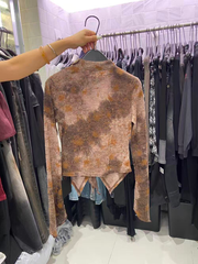 A lady's necklace with tie-dyed lace top