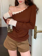 A sexy knitted top with contrasting color buttons for women