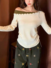 A sexy knitted top with contrasting color buttons for women