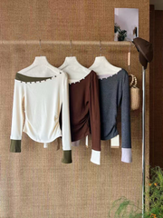 A sexy knitted top with contrasting color buttons for women