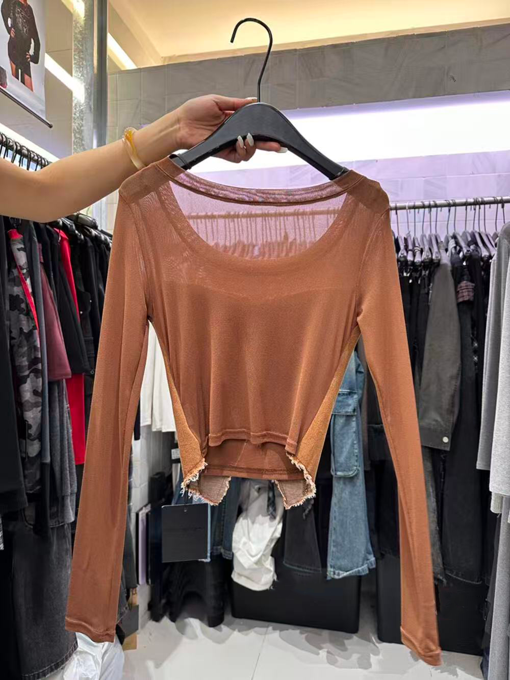 A lady's fitted long-sleeved top with patchwork A lady's fitted long-sleeved top with patchwork