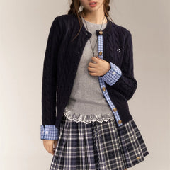Embroidered sweater with checked knitted cardigan