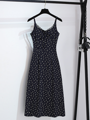 A two-piece set of floral halter dress and cardigan