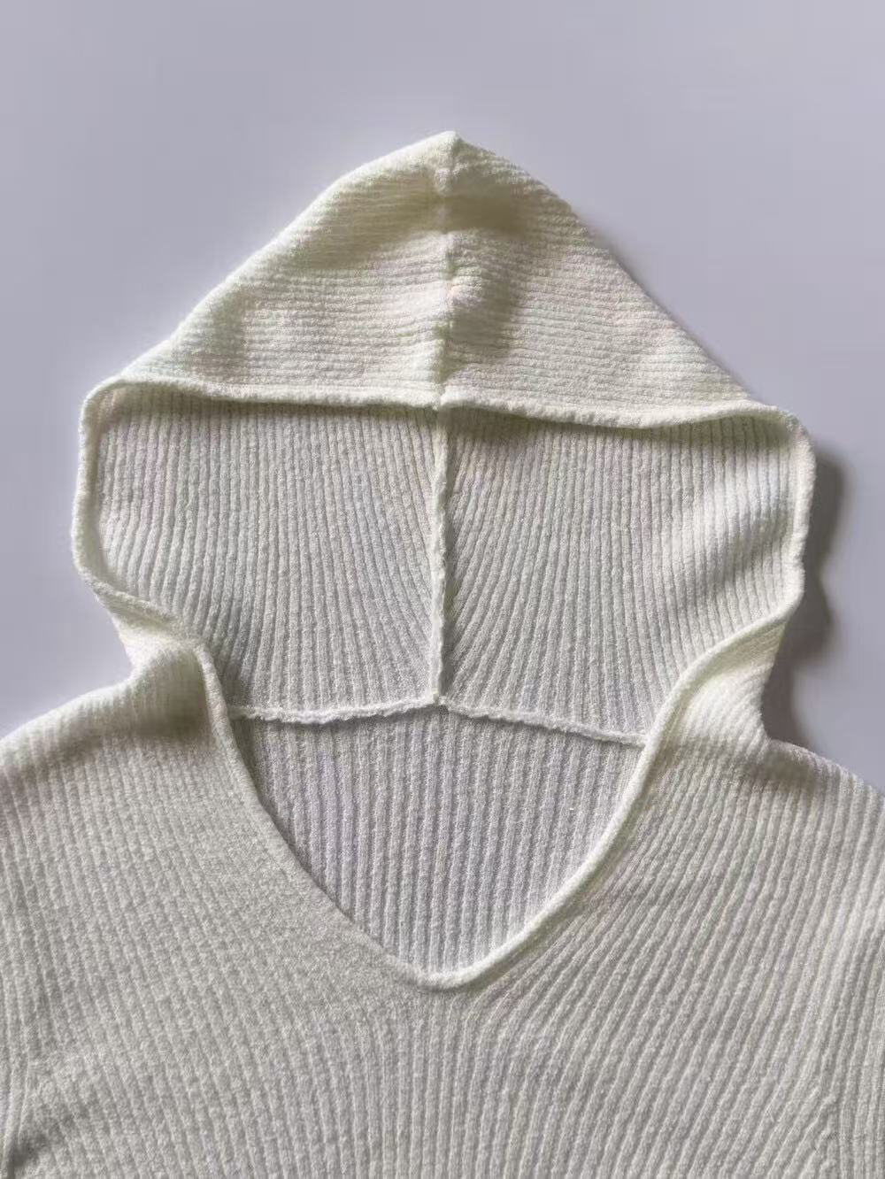 A thin hooded knitted top for women