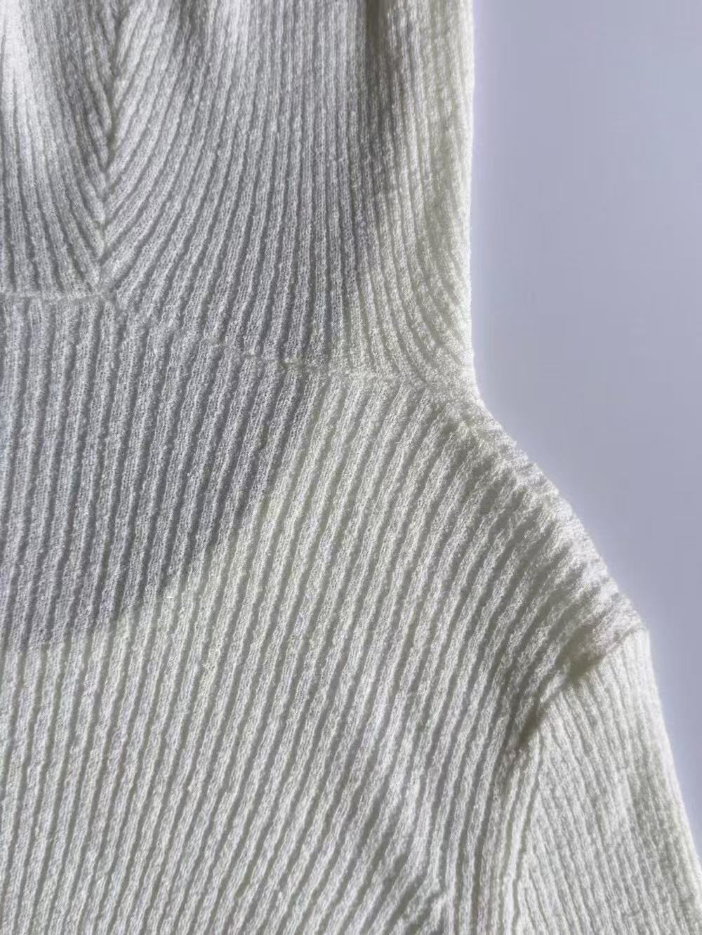 A thin hooded knitted top for women