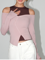 A two-piece set of one-shoulder long-sleeved knitted sweater paired with a vest