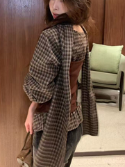 A long-sleeved top with checkered and color-blocking patterns for women